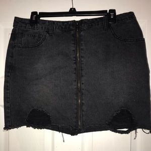 Distressed black jean skirt